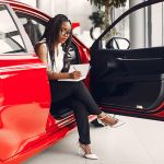 Woman in car showroom